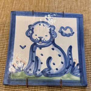 Charming Blue and White Ceramic Tile with Playful Animal Design